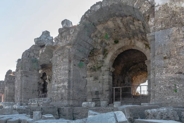 The ruins of the ancient Roman city of Side in Turkey. The remains of buildings, theater and other infrastructure of the ancient city. Historical monuments of ancient Greek and Roman eras.