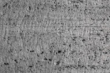 Pürüzlü taş yüzeye dokulu. Gri kireç taşı. Yüzey blok testere ile oluşturulur. Arka plan görüntüsü. İnşaat malzemesi.