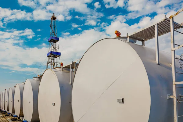 Foreground Gray Cylindrical Tanks Storing Oil Fuel Reserves Located Horizontally Royalty Free Stock Photos