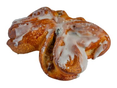 İzole et. Kuru üzümlü tatlı rulo. Üstü beyaz jöleli olsun. Yan görünüm.