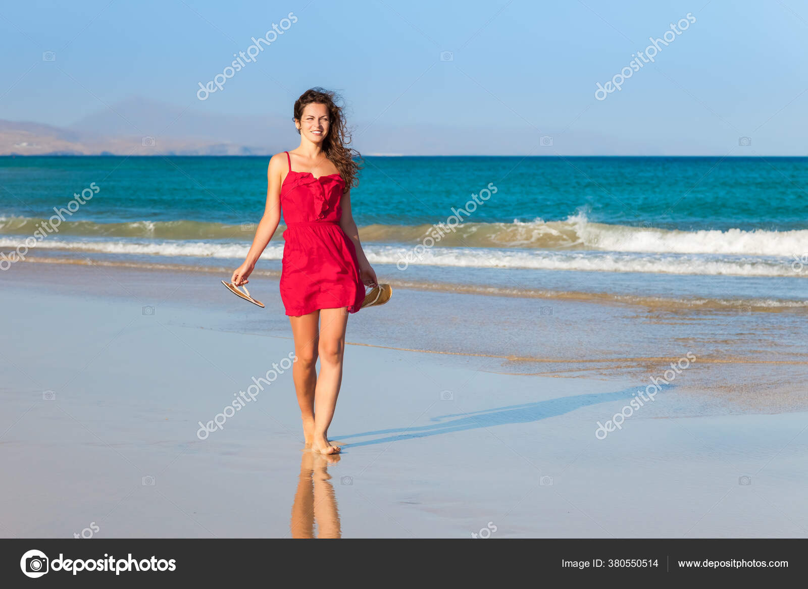 Young woman in red dress enjoying the beach — Stock Photo © sborisov ...