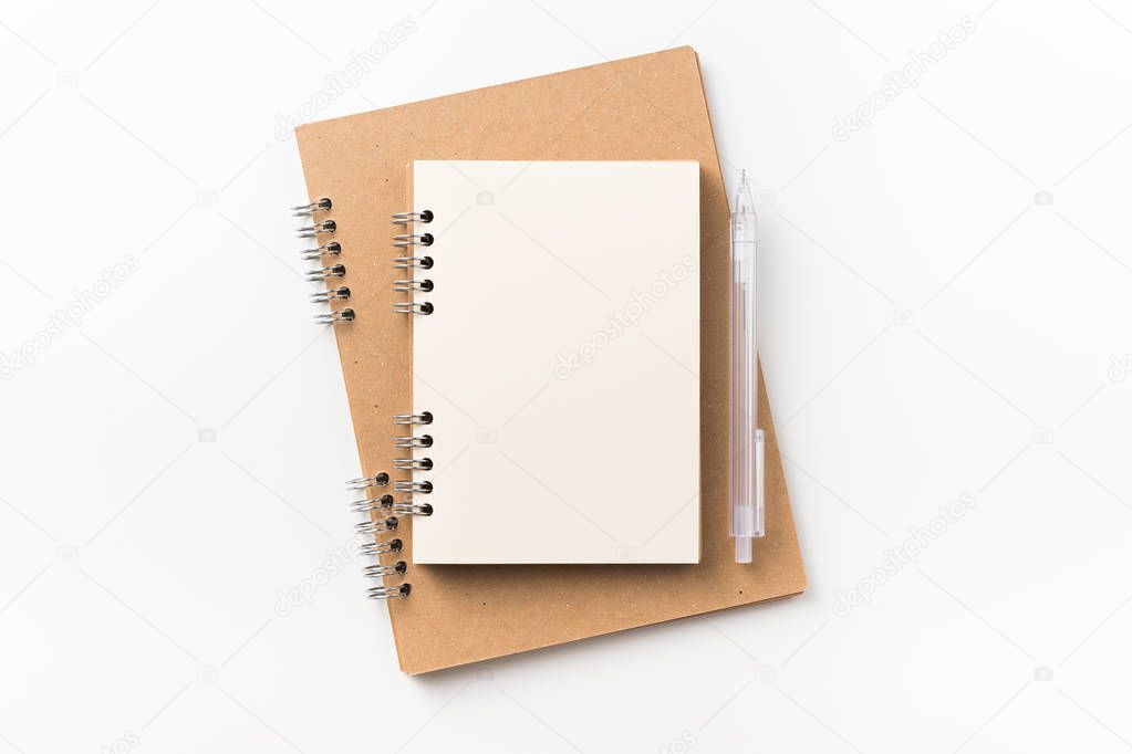 Design concept - Top view of two kraft spiral notebook, blank page, mechanical pencil isolated on white background for mockup