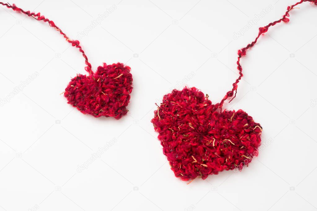wool weaved red heart with line isolated on white background for romantic valentines day design concept