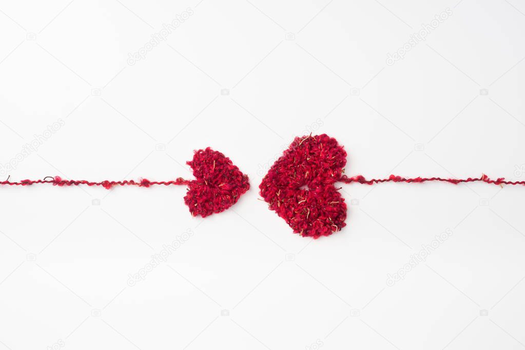 wool weaved red heart with line isolated on white background for romantic valentines day design concept