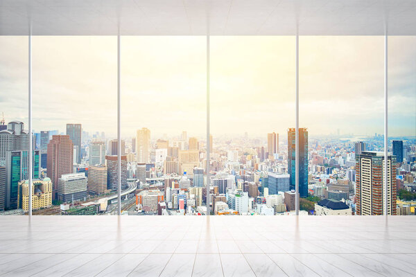 Business and design concept - empty marble floor and window with panoramic modern cityscape building bird eye aerial view of Osaka, Japan, for display or mock up