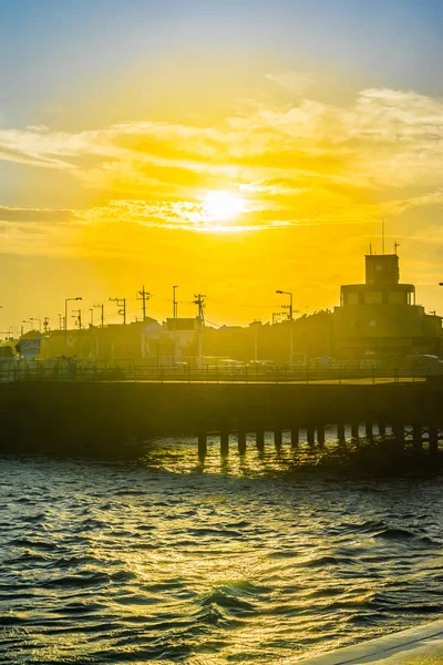 Asia travel and culture concept - beautiful sunset and street view with dramatic sky in kamakura, Japan.