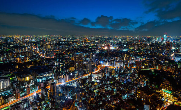 Panoramic view of city buildings at night, Tokyo, Japan