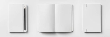 Ön kapalı manzaralı, elastik bant ve kalemle açılan ve geri dönen dizüstü bilgisayarlar. 