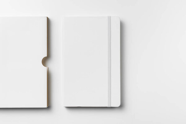 White notebook with elastic band, case isolated on white background for mockup.