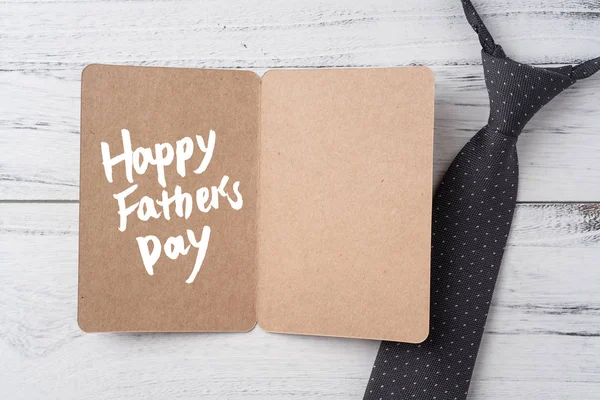 Fathers Day Layout Kraft Greeting Card Necktie White Wooden Background — Stock Photo, Image