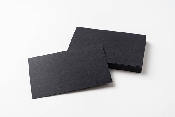 Black business cards isolated on white background for mockup