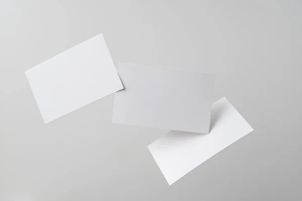 White Business Cards Flying Air Grey Background Mockup — Stock Photo, Image