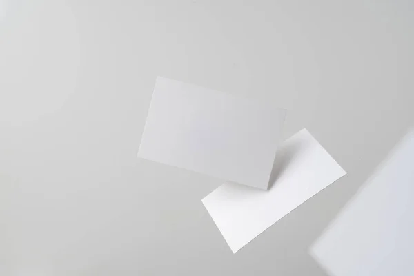 White Business Cards Flying Air Grey Background Mockup — Stock Photo, Image