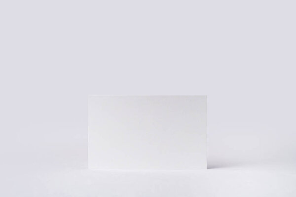 White business card isolated on white background for mockup
