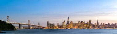 San Francisco downtown skyline at dusk from Treasure Island, California, sunset, USA. Panorama clipart