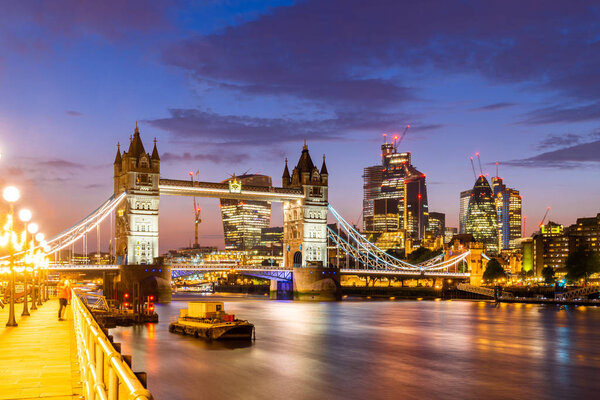 London Tower Bridge with London downtown skylines building in background, London UK.