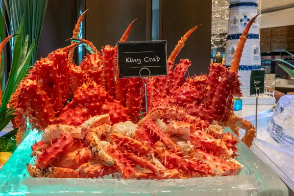 Alaskan King crab in seafood on ice buffet bar