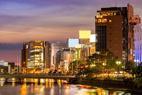 Fukuoka old town along naka river at Nakasukawabata sunset twilight. This area is favorite for tourist for Fukuoka Yatai, street Food stall,  for hangout at night.