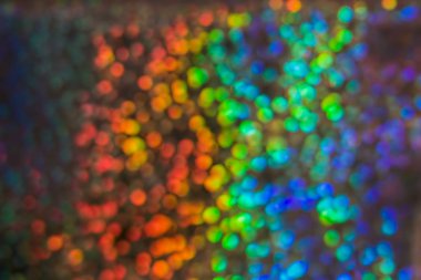 Birçok ışık ile çok renkli arka plan bulanıklık. Pullu gelen güneş ışınları Glitter.