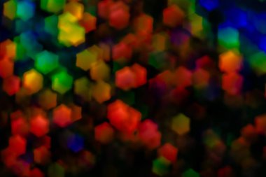 Bir Altıgen şeklinde çok renkli parlama. 3d arka plan. Kırmızı, siyah, mavi, sarı, yeşil ışıklar Parlatıcı.