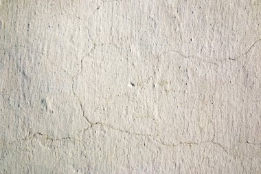 Soyut arka plan. İnce çatlaklar ile beyaz kireç duvar.