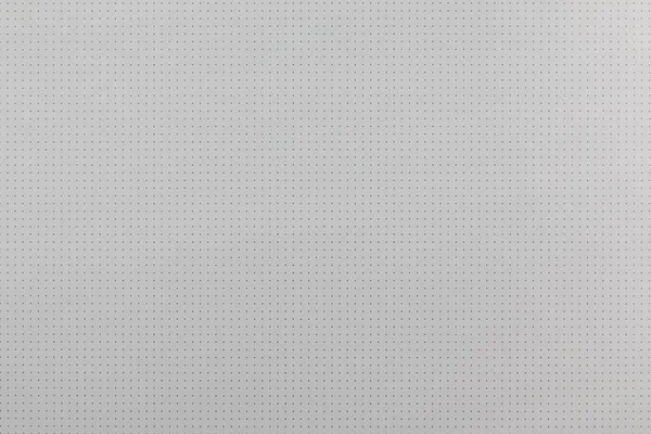 Abstract background. Empty white surface with small holes or dots. Abstract background. Empty white surface with small holes. Perforated plastic plate — Stock Photo, Image