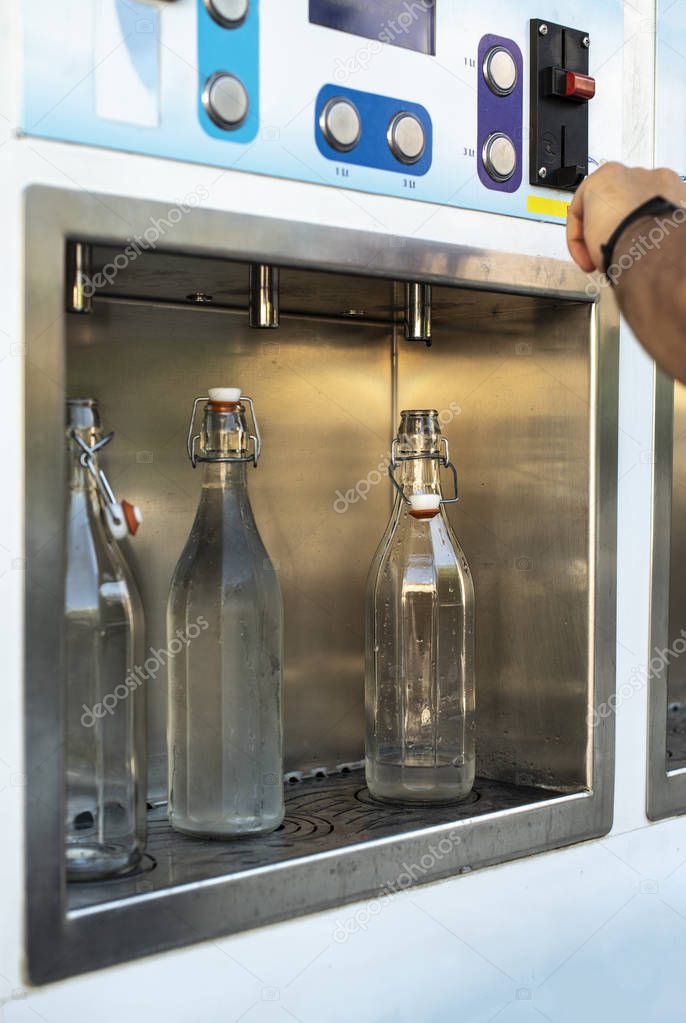 Mineral Water machine on the street. Pay and load drinking water