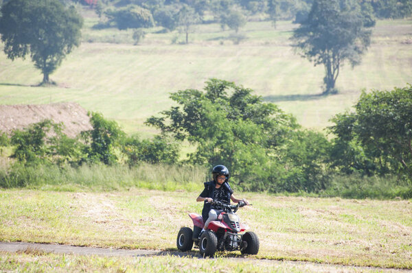 small kid on quadro bike 