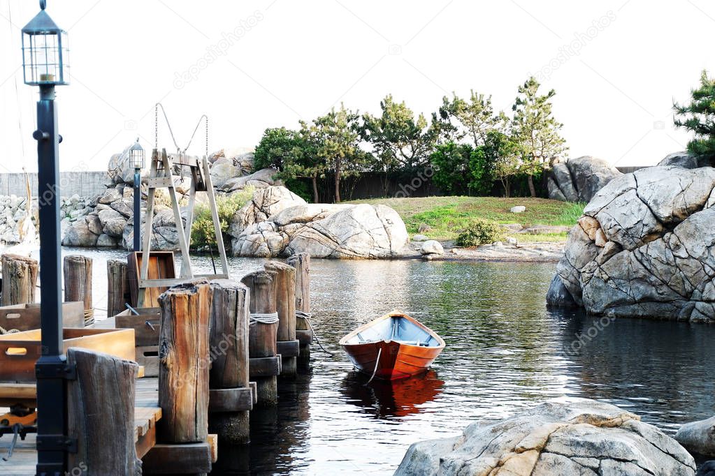floating wooden boat in lake near pier, Tokyo