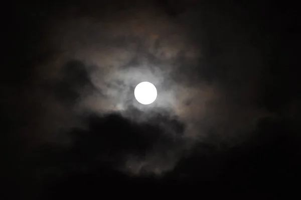 Super Full Moon with clouds at Night, Dramatic cumulus clouds in the moonlight