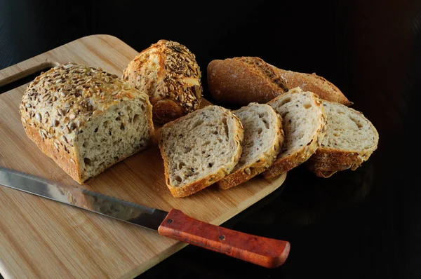 fresh variety bread on black background, food, diet, low carbohydrate high fat, gluten free,weight loss,