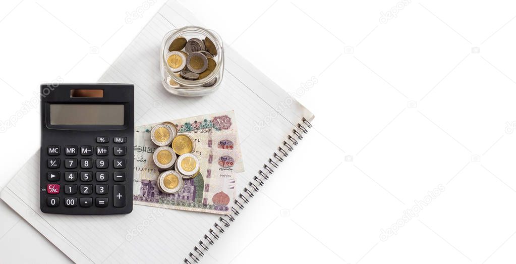 Banknotes and Calculator with Notebook, Egyptian Money, White Background, Space for Text