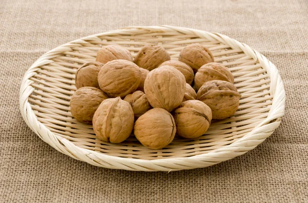 Walnuts Bamboo Sieve Burlap Background — Stock Photo, Image