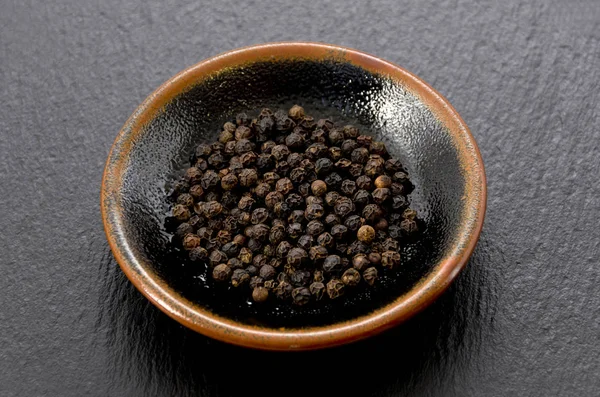 Black Pepper Dish Black Stone Plate — Stock Photo, Image