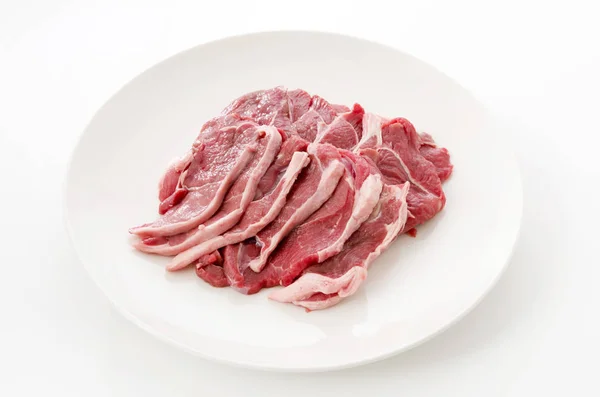 Raw Lamb Meat White Plate White Background — Zdjęcie stockowe