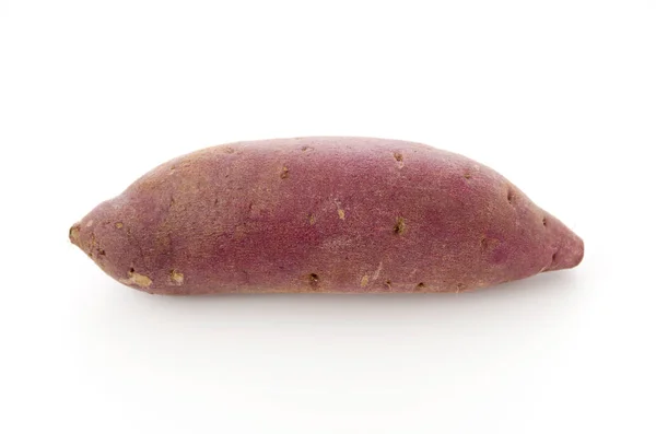 Raw Japanese sweet potatoes on white background