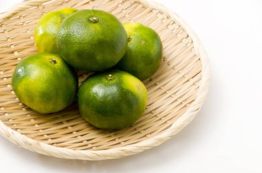 Citrus unshiu, mandarin satsuma orange on Bamboo eleve