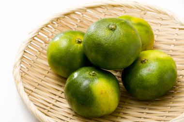 Citrus unshiu, mandarin satsuma orange on Bamboo eleve