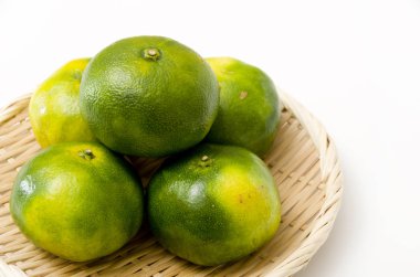 Citrus unshiu, mandarin satsuma orange on Bamboo eleve