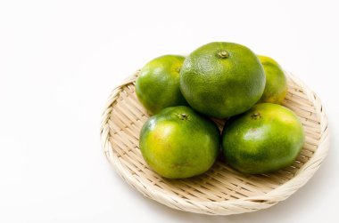 Citrus unshiu, mandarin satsuma orange on Bamboo eleve