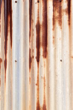 Paslı metal duvar, paslı çinko grunge arka plan oluklu.