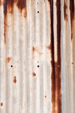 Paslı metal duvar, paslı çinko grunge arka plan oluklu.