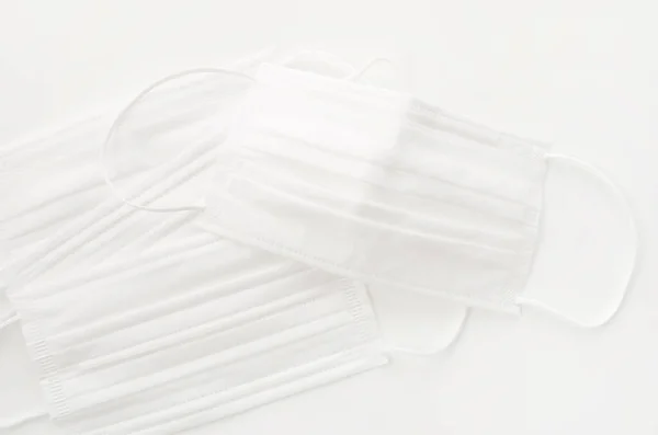 Disposable face mask on white background