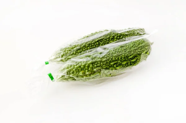 Färsk Goya Bitter Melon Plastpåse Vit Bakgrund — Stockfoto