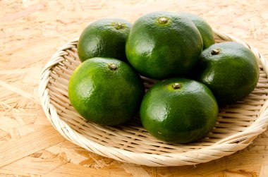 Citrus unshiu, mandarin satsuma orange on Bamboo eleve