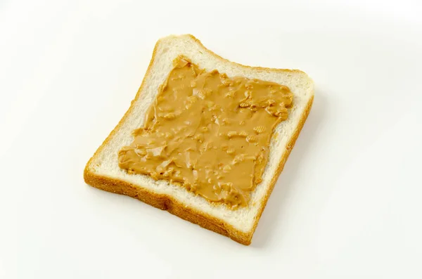 Erdnussbutter Auf Einer Scheibe Weißbrot — Stockfoto