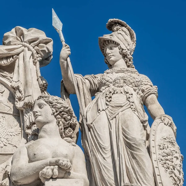 Beautiful sphinx and Roman woman warrior at the roof top in front of blue sky in Vienna, Austria