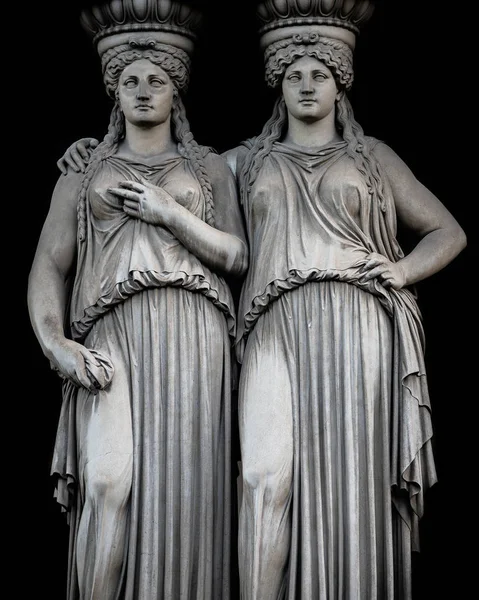 Statue of two sensual Roman renaissance era women at Parliament building in Vienna, Austria