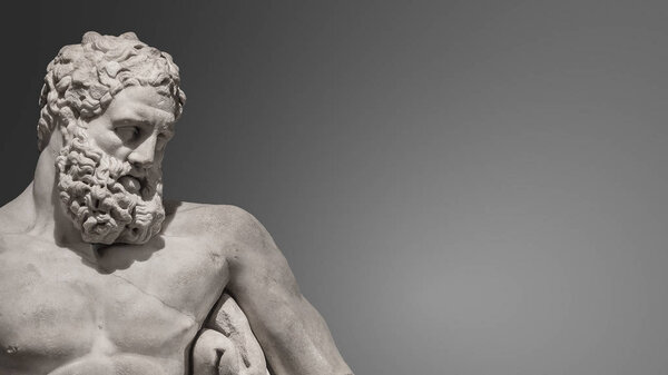 Statue of powerful and handsome bearded Hercules, closeup, detai