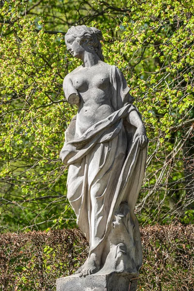 Old statue of a sensual Renaissance era woman in park of Potsdam — Stock Photo, Image